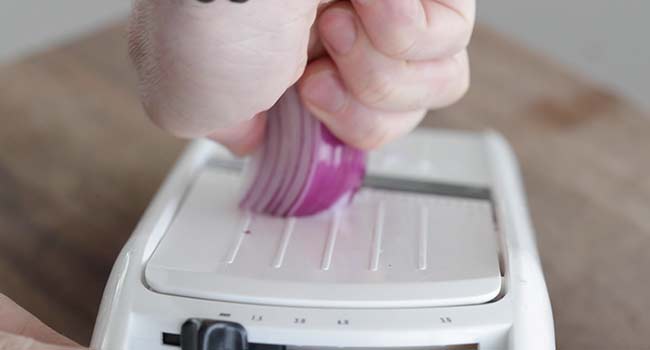 slicing red onions