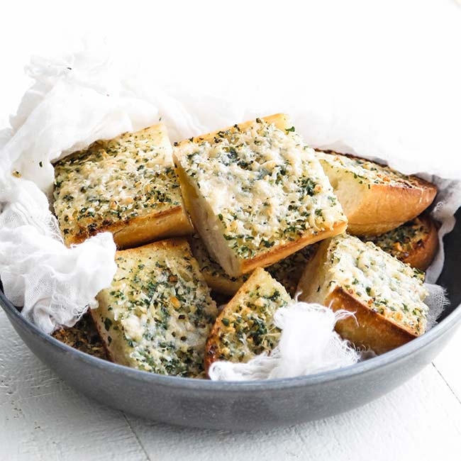 bowl of garlic bread with herbs