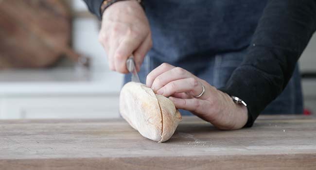 slicing french bread in half