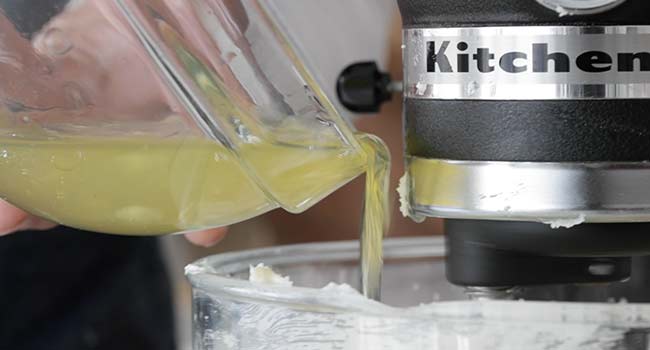 adding egg whites to a stand mixer