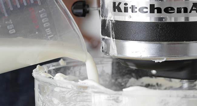 adding buttermilk to a mixer