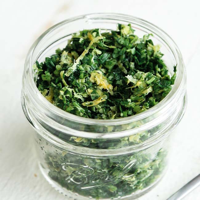 parsley and garlic in a jar with lemon zest