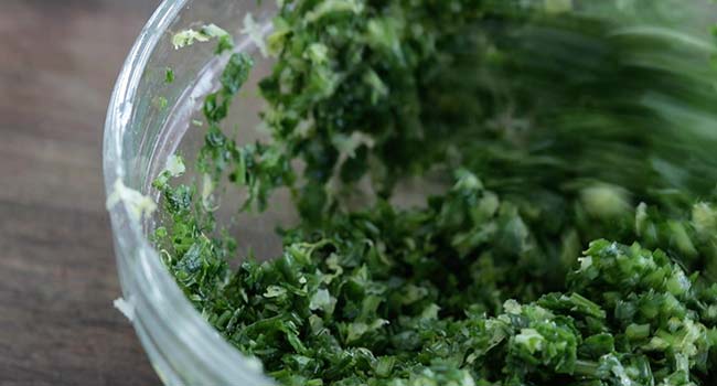 mixing together gremolata