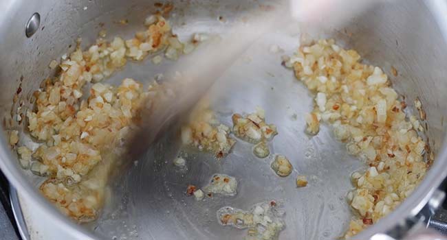 cooking garlic and onions in the pot