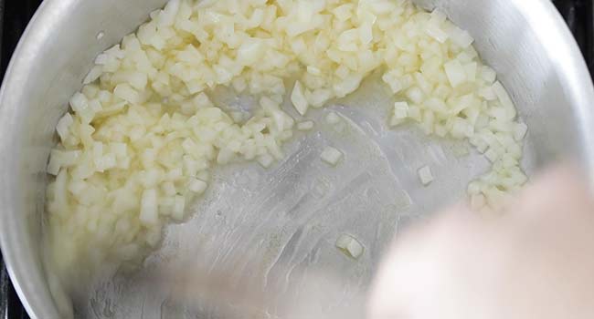 sautéing onions in a pan