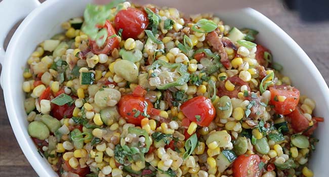 garnishing succotash with green onions