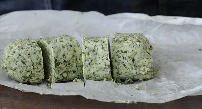 slicing frozen herb butter