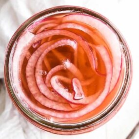 pickled red onions in a jar