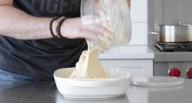 transferring dough to a casserole dish