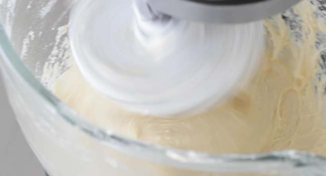 mixing a gooey butter cake dough together