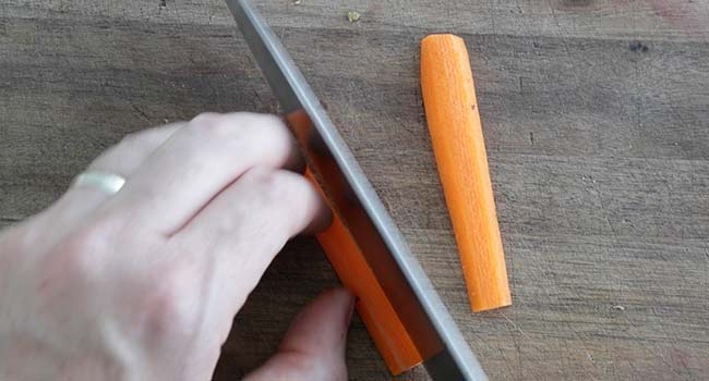 cutting fresh carrots