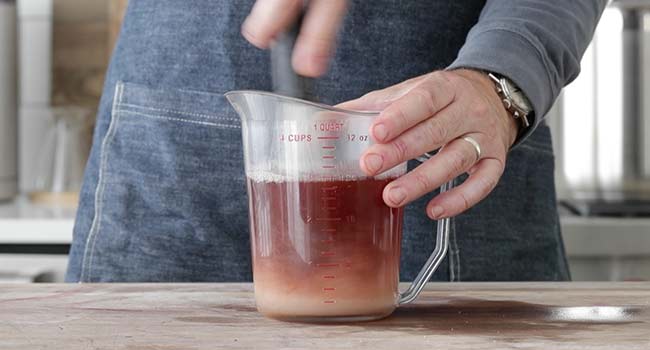 whisking together a brine