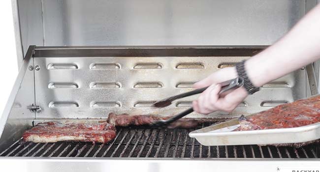 removing seared bbq pork steaks