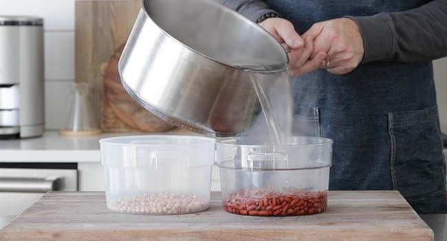 pouring boiling water over dried beans