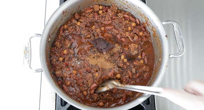 mixing chocolate and cinnamon with chili