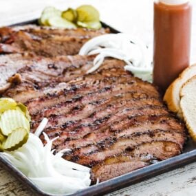 sliced smoked brisket on a platter