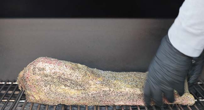 adding a brisket to a smoker