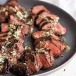 sliced coulotte steak on a plate