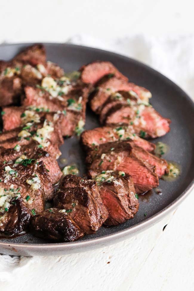 sliced coulotte steak on a plate