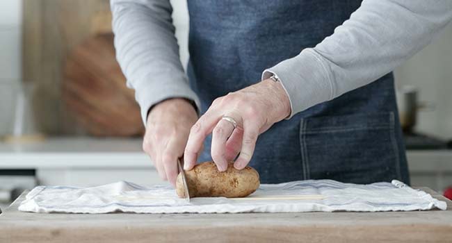 slicing potatoes on skweres