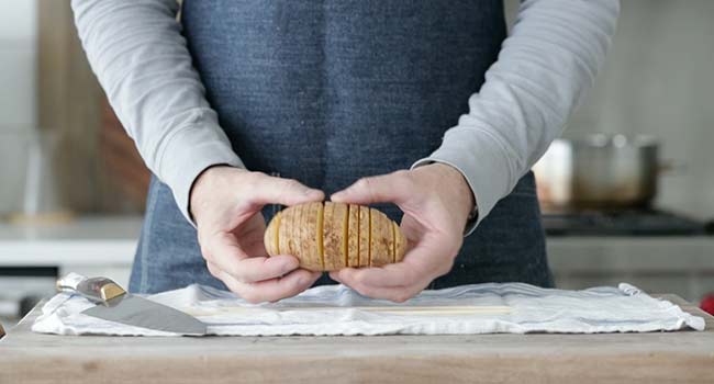 a hasselback potatoes that is fanned out