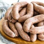 italian sausage links on a cutting board