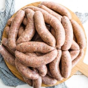 Italian sausage links on a cutting board