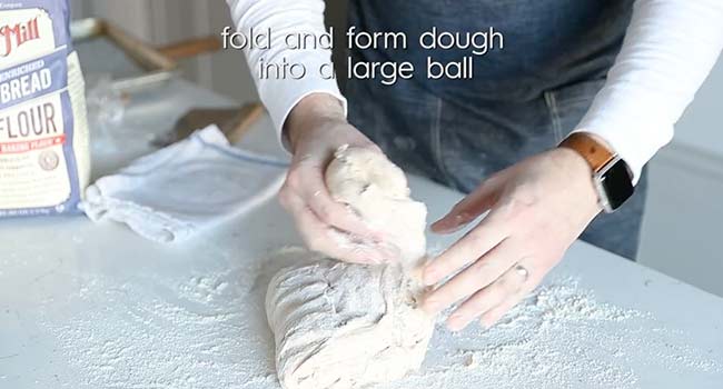 folding pizza dough over