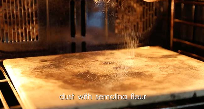 dusting a pizza stone with semolina