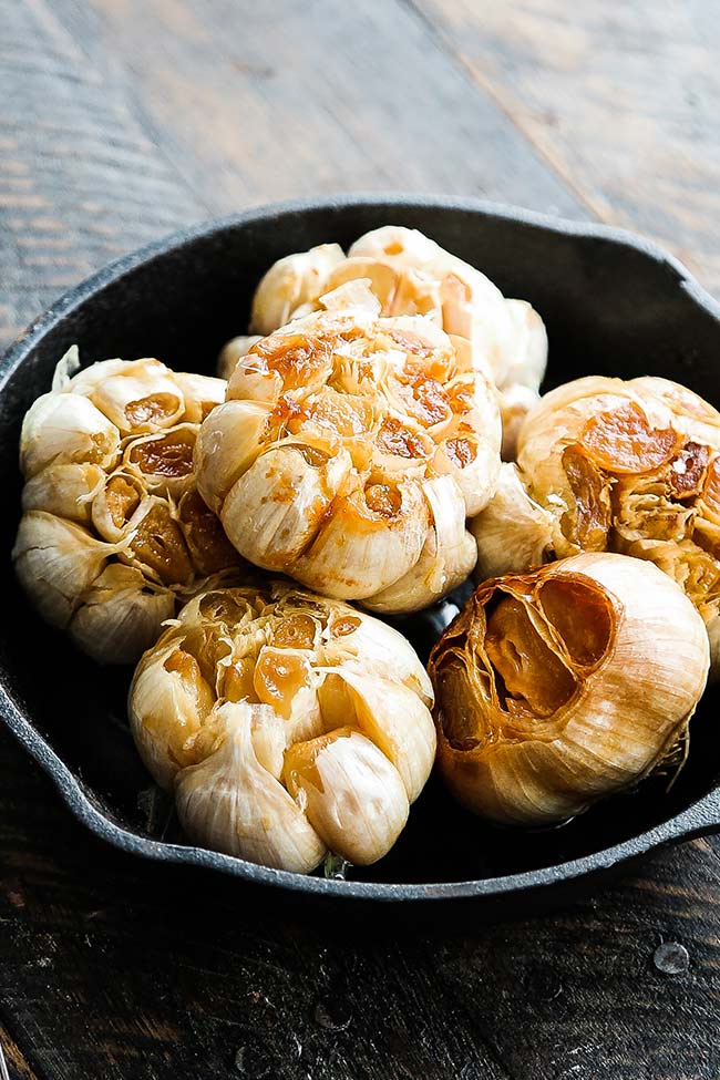 bulbs of roasted garlic in a pan