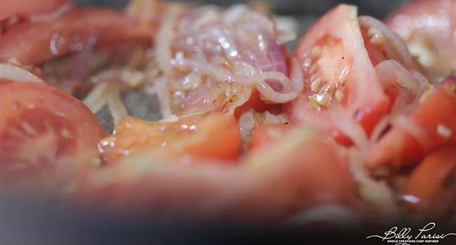 sautéing tomatoes with onions