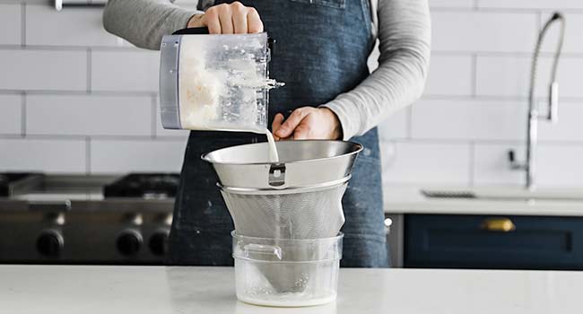 straining butter with buttermilk