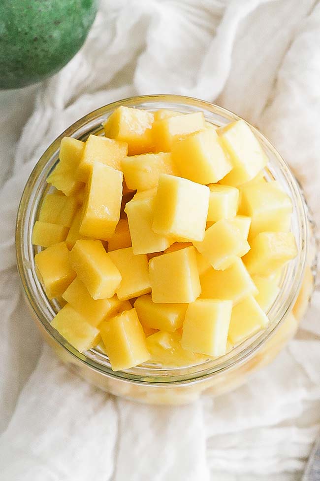 medium diced fresh mango in a jar