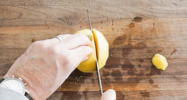 slicing down on a mango