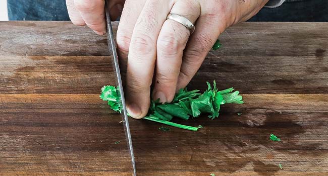 chopping fresh cilantro