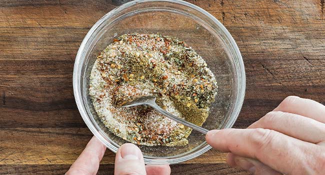 mixing spices in a bowl