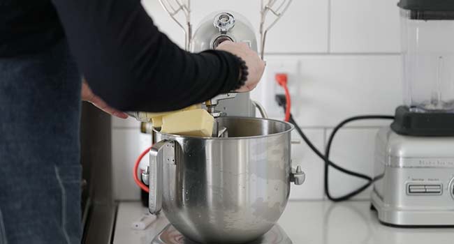 adding butter to a stand mixer