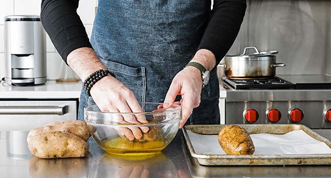 coating potatoes in oil and salt