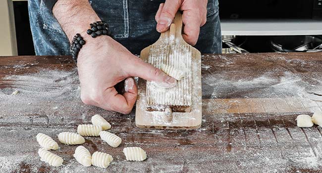 forming gnocchi on a gnocchi board