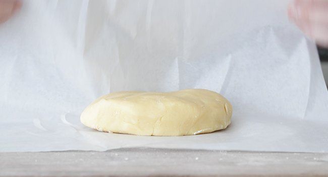 wrapping dough in a parchment paper