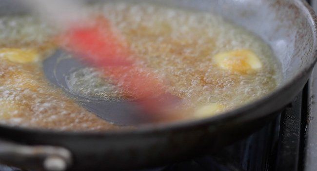 adding butter to caramel