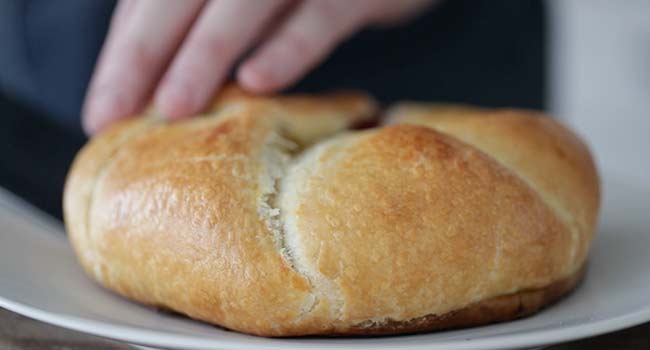 adding brie en croute to a plate