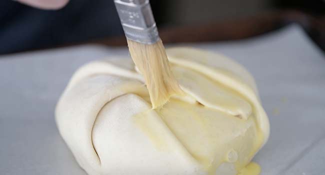 brushing puff pastry with an egg wash