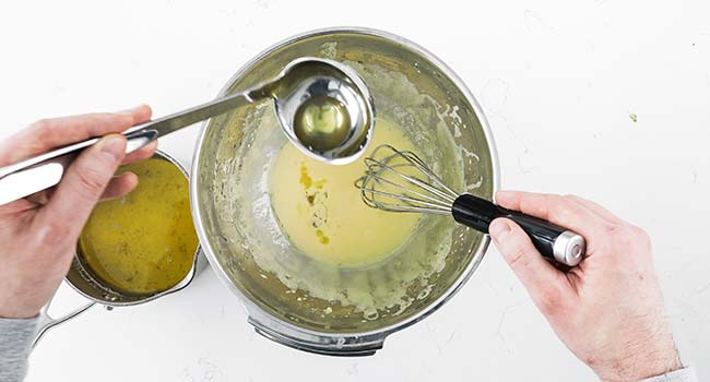 drizzling in clarified butter to a hollandaise sauce