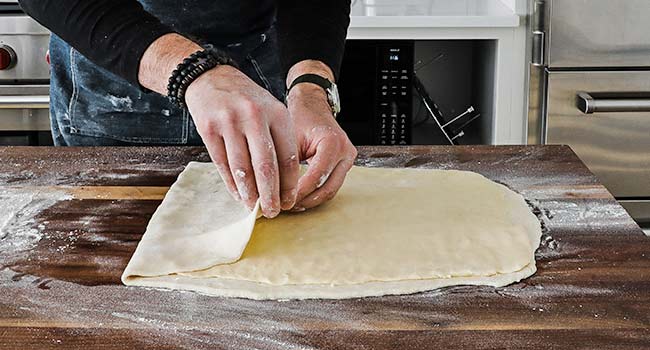 folding dough over butter