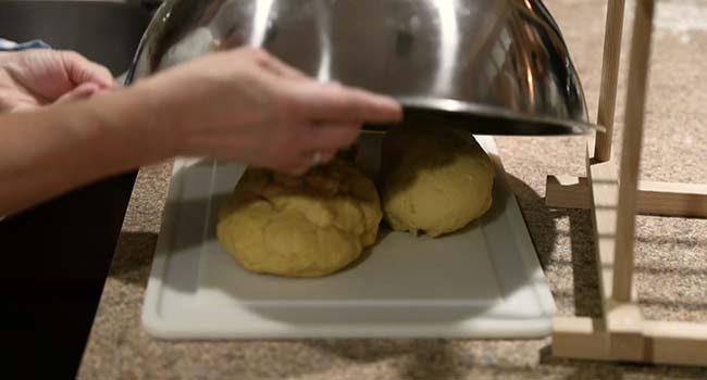 resting pasta dough under a bowl