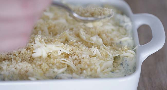 adding breadcrumbs to a artichoke and spinach dip