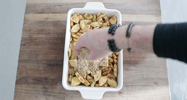 adding a streusel to a casserole dish