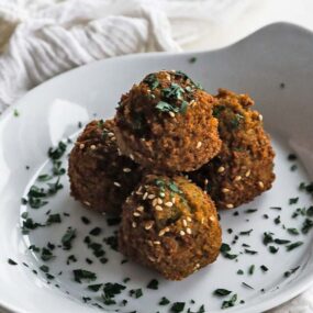 plate with falafel and parsley