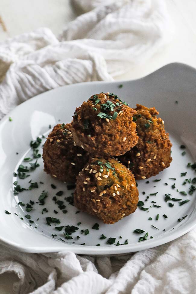 plate with falafel and parsley